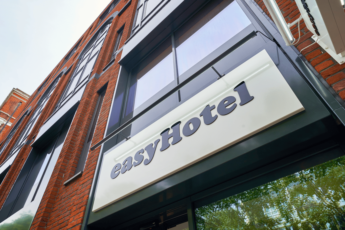 easyHotel London City Shoreditch exterior, showing the hotel sign and red brick building facade.